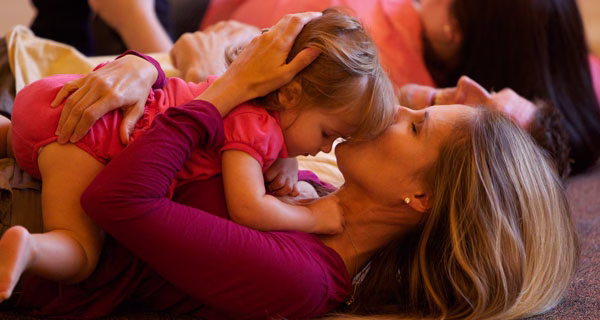 Mom and child hugging for lullaby time