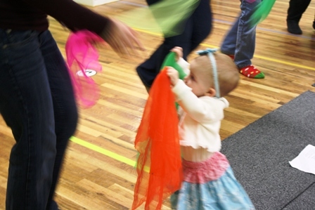 Dancing with scarves in a Mixed Ages Music Together class