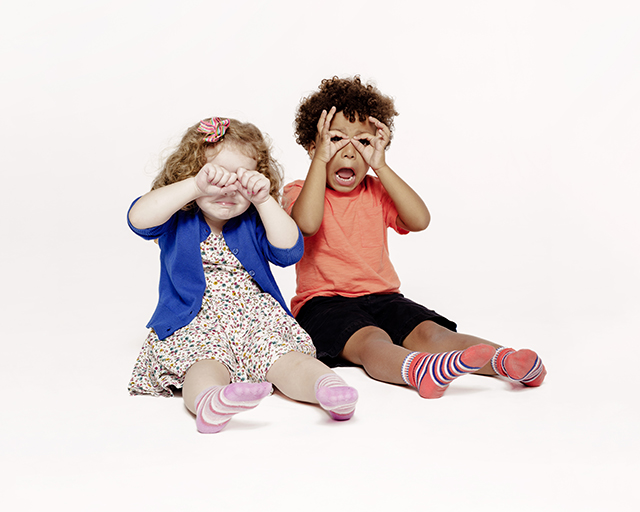 Children singing a song and pretending to be owls