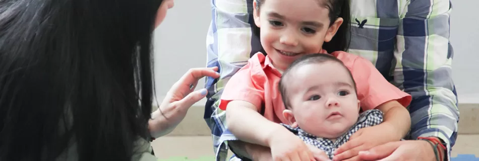 IA family singing together in a Music Together class