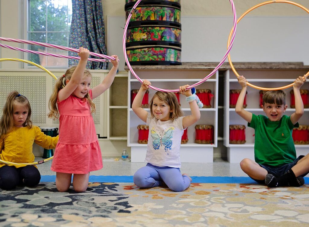 Children dancing with hoops
